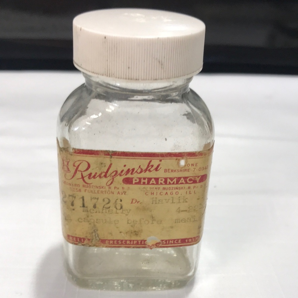 Rudinski Pharmacy Glass Bottle with Red Label